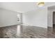 Inviting living room featuring stylish wood laminate flooring and a sunlit window at 4825 Estes St, Arvada, CO 80002