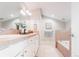 Bathroom with a double sink vanity, white cabinets, and separate tub at 1699 N Downing St # 409, Denver, CO 80218