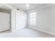 Bright bedroom with two closets, carpet and a large window at 1699 N Downing St # 409, Denver, CO 80218