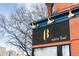 Exterior view of a stylish wine bar with its elegant signage and outdoor lighting at 1699 N Downing St # 409, Denver, CO 80218