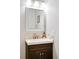 Elegant bathroom with a modern vanity, sleek faucet, and a decorative tiled backsplash at 9770 Quitman Way, Westminster, CO 80031