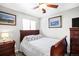 Serene bedroom with a wooden sleigh bed, classic furnishings, and neutral color palette at 9770 Quitman Way, Westminster, CO 80031