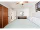 Bedroom with a large bed and a view to the closet and bathroom doors at 9770 Quitman Way, Westminster, CO 80031