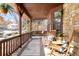 Inviting front porch featuring rocking chairs and a comfortable bench swing at 9770 Quitman Way, Westminster, CO 80031