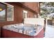 Close up of Hot Tub situated along wooden siding on the rear of the home at 9770 Quitman Way, Westminster, CO 80031