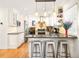 Well-lit kitchen featuring granite countertops, white cabinets, and stainless steel appliances at 9770 Quitman Way, Westminster, CO 80031