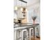 Kitchen with a breakfast bar area with industrial-style stools and hanging lights at 9770 Quitman Way, Westminster, CO 80031