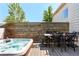Outdoor deck features a hot tub and wood picnic table for relaxing and entertaining at 633 W 114Th Way, Northglenn, CO 80234