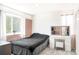 Bright bedroom with a large window, vanity, makeup mirror, and light-colored carpet flooring at 633 W 114Th Way, Northglenn, CO 80234