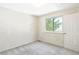 Bedroom features bright natural light and neutral carpet flooring at 633 W 114Th Way, Northglenn, CO 80234