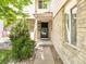Inviting front entrance with stone details, a well kept yard, and a sturdy front door at 633 W 114Th Way, Northglenn, CO 80234