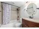 Basement bathroom with shower/tub combo and updated vanity at 3546 N Garfield St, Denver, CO 80205