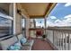 Outdoor balcony featuring seating, outdoor lighting, and views at 6001 Castlegate Dr # A33, Castle Rock, CO 80108