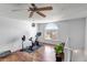 Bright bonus room with exercise bike and large window, offering a versatile space at 6001 Castlegate Dr # A33, Castle Rock, CO 80108