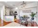 Dining area adjacent to the kitchen, with a stylish light fixture at 6001 Castlegate Dr # A33, Castle Rock, CO 80108