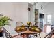 Cozy dining area with a table set for four, featuring a fireplace and open design at 6001 Castlegate Dr # A33, Castle Rock, CO 80108