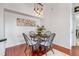 Cozy dining room with a modern chandelier and seating for four, ideal for gatherings at 6001 Castlegate Dr # A33, Castle Rock, CO 80108