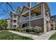 Inviting condo exterior featuring multiple balconies, neutral tones, and well-maintained landscaping at 6001 Castlegate Dr # A33, Castle Rock, CO 80108