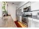 Kitchen area featuring stainless steel appliances and white cabinets at 6001 Castlegate Dr # A33, Castle Rock, CO 80108
