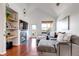 Bright living room with vaulted ceiling, fireplace, access to the balcony, and a large couch at 6001 Castlegate Dr # A33, Castle Rock, CO 80108