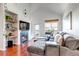 Inviting living room with a vaulted ceiling, fireplace and outside views at 6001 Castlegate Dr # A33, Castle Rock, CO 80108