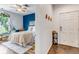 Comfortable bedroom featuring a blue accent wall and entry to the main living space at 6001 Castlegate Dr # A33, Castle Rock, CO 80108