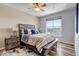 Serene main bedroom featuring a comfortable bed and a large window with scenic views at 6001 Castlegate Dr # A33, Castle Rock, CO 80108