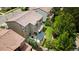 An aerial view showcases this home's beautiful backyard with a patio pergola and mature landscaping at 2347 S Loveland St, Lakewood, CO 80228