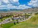 An aerial view captures the community featuring a church, green spaces, and a winding walking path at 2347 S Loveland St, Lakewood, CO 80228