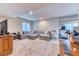 Spacious finished basement with a large sectional sofa and ample room for recreation at 2347 S Loveland St, Lakewood, CO 80228