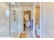 Bathroom featuring a glass shower, walk-in closet, and a separate toilet room at 2347 S Loveland St, Lakewood, CO 80228