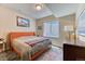 Basement bedroom with a small window and light color scheme at 2347 S Loveland St, Lakewood, CO 80228