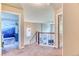 Bright hallway with carpet and view of mural bedroom at 2347 S Loveland St, Lakewood, CO 80228