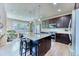 Bright kitchen featuring an island, granite countertops, and stainless steel appliances, offering a modern cooking space at 2347 S Loveland St, Lakewood, CO 80228
