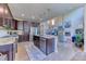 Spacious kitchen with dark cabinetry, stainless steel appliances, and an island, perfect for cooking and entertaining at 2347 S Loveland St, Lakewood, CO 80228