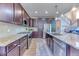 Beautiful kitchen with dark wood cabinets, stainless steel appliances, and granite countertops at 2347 S Loveland St, Lakewood, CO 80228