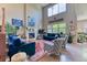 Airy living room featuring a fireplace, abundant natural light, and stylish furnishings, creating a serene atmosphere at 2347 S Loveland St, Lakewood, CO 80228