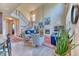 Bright living room features a fireplace, high ceilings, large windows and elegant decor at 2347 S Loveland St, Lakewood, CO 80228