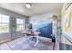 Charming office space with custom mountain mural, large windows, and modern desk setup at 2347 S Loveland St, Lakewood, CO 80228