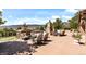 Enjoy outdoor living on this stone patio with mountain views, featuring comfortable seating and a stone fireplace at 2347 S Loveland St, Lakewood, CO 80228