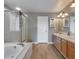 Bathroom featuring a separate shower and tub and double vanity at 10695 Wynspire Rd, Highlands Ranch, CO 80130
