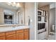 Bathroom with oak cabinets and a shower/tub combo at 10695 Wynspire Rd, Highlands Ranch, CO 80130