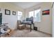 Bright bedroom with a desk and large windows offering natural light and views at 10695 Wynspire Rd, Highlands Ranch, CO 80130