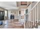 Entry way with staircase, hardwood floors, neutral walls, and a partial view into the living room at 10695 Wynspire Rd, Highlands Ranch, CO 80130
