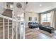 This home features a staircase that leads into a living room with hardwood floors at 10695 Wynspire Rd, Highlands Ranch, CO 80130