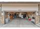 Two car garage showing storage and organizational items with home address number above the door at 10695 Wynspire Rd, Highlands Ranch, CO 80130