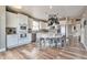Bright eat-in kitchen with white cabinets, granite countertops, and stainless steel appliances at 10695 Wynspire Rd, Highlands Ranch, CO 80130