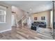 Inviting living room featuring wood floors and a staircase leading to the upper level at 10695 Wynspire Rd, Highlands Ranch, CO 80130