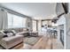 This spacious living room with hardwood floors is conveniently near the kitchen at 10695 Wynspire Rd, Highlands Ranch, CO 80130