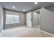 Neutral room featuring carpet, gray walls, a window with blinds, a white door and modern lighting at 10695 Wynspire Rd, Highlands Ranch, CO 80130